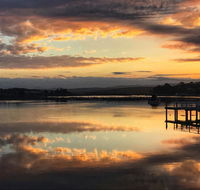 Reflections on Merimbula Lake - Tourism Brisbane